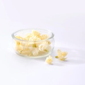 White Jasmine Flowers in Glass Bowl on White Background